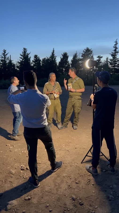 Soldiers at dusk with lights and the crew
